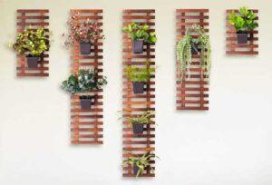 Wood Slat Vertical Garden with Hanging Plants on Wall